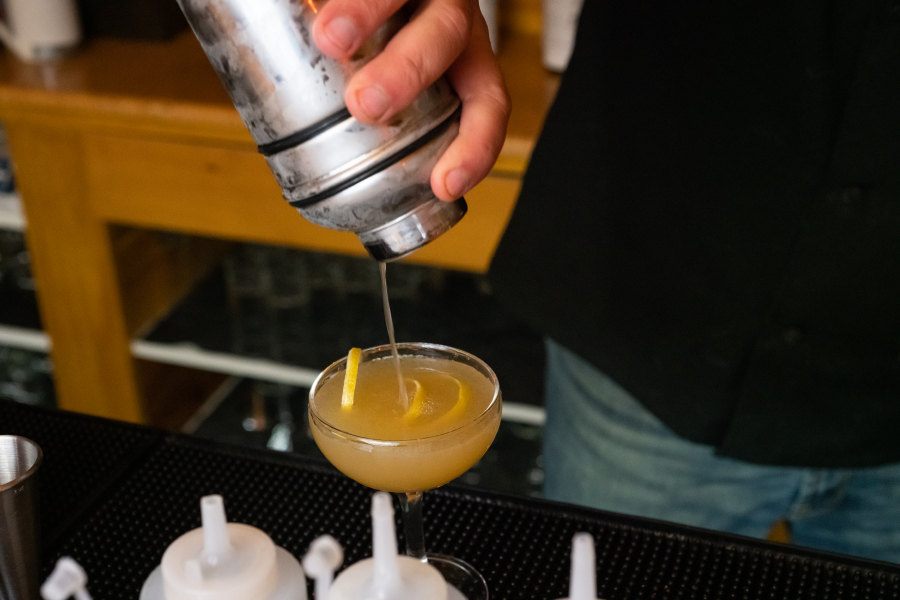 Sidecar cocktail pouring