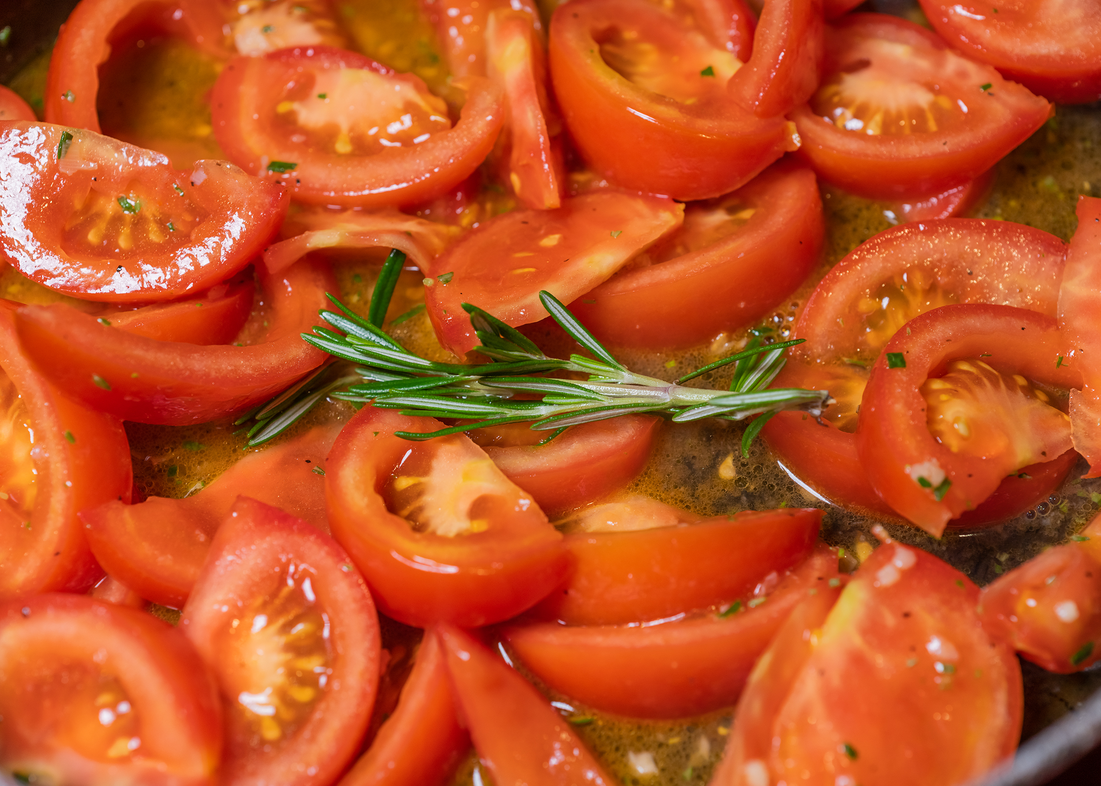 Chopped tomatoes with rosemary sprig